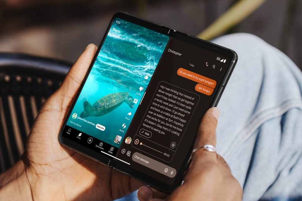 A person using the Google Pixel Fold smartphone.