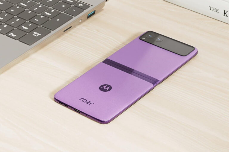 A Motorola Razr folding phone lying on a desk.